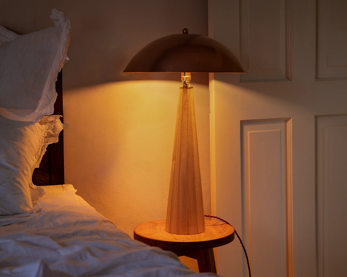 Copper lamp lit showing warm diffused glow