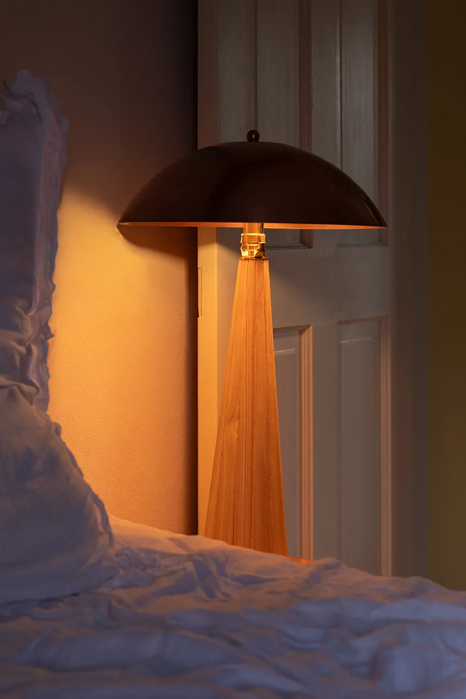 Copper lamp lit showing warm diffused glow
