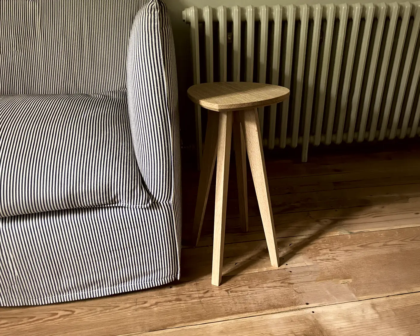 Solid oak side table with a uniquely shaped top