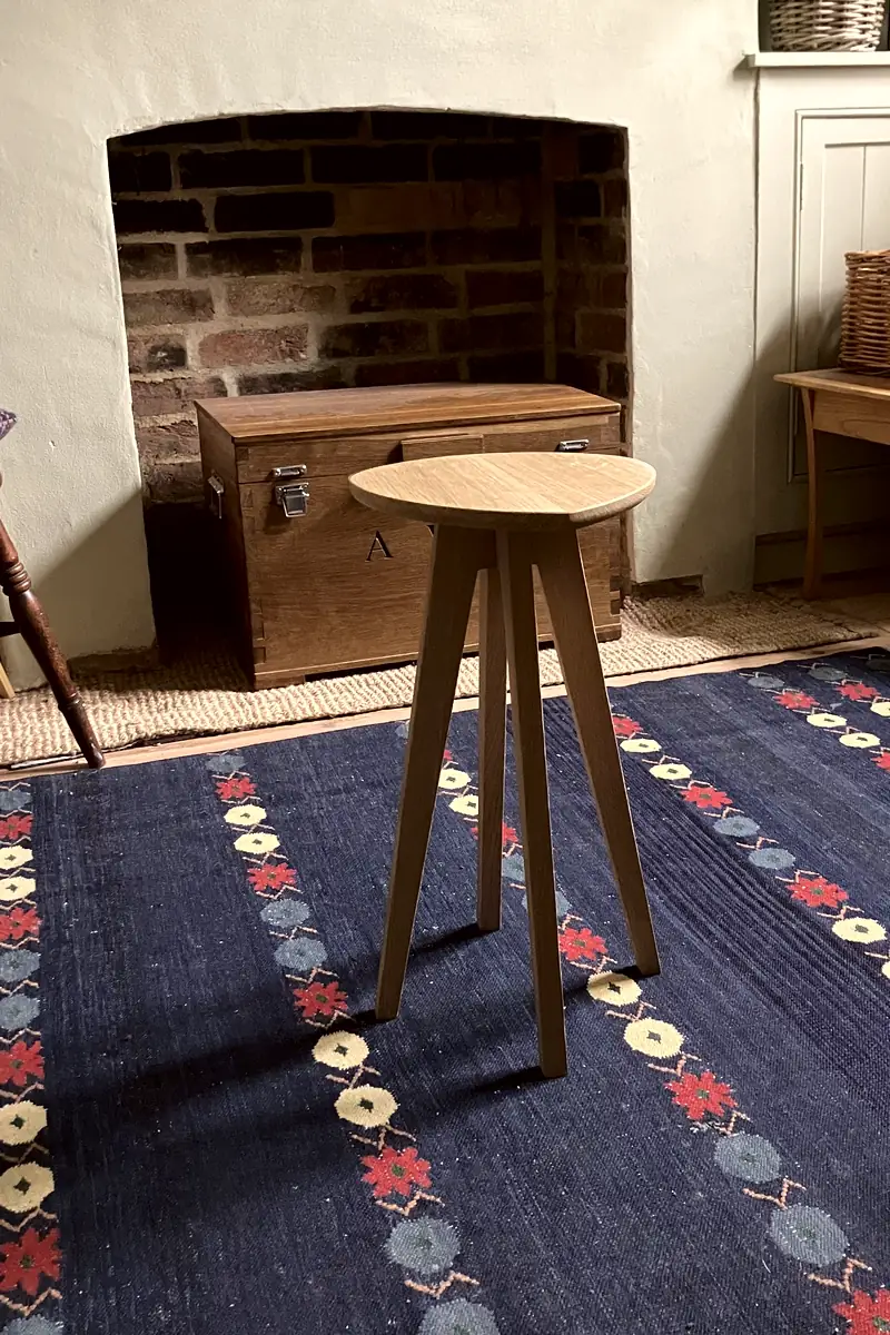 Solid oak side table with a uniquely shaped top