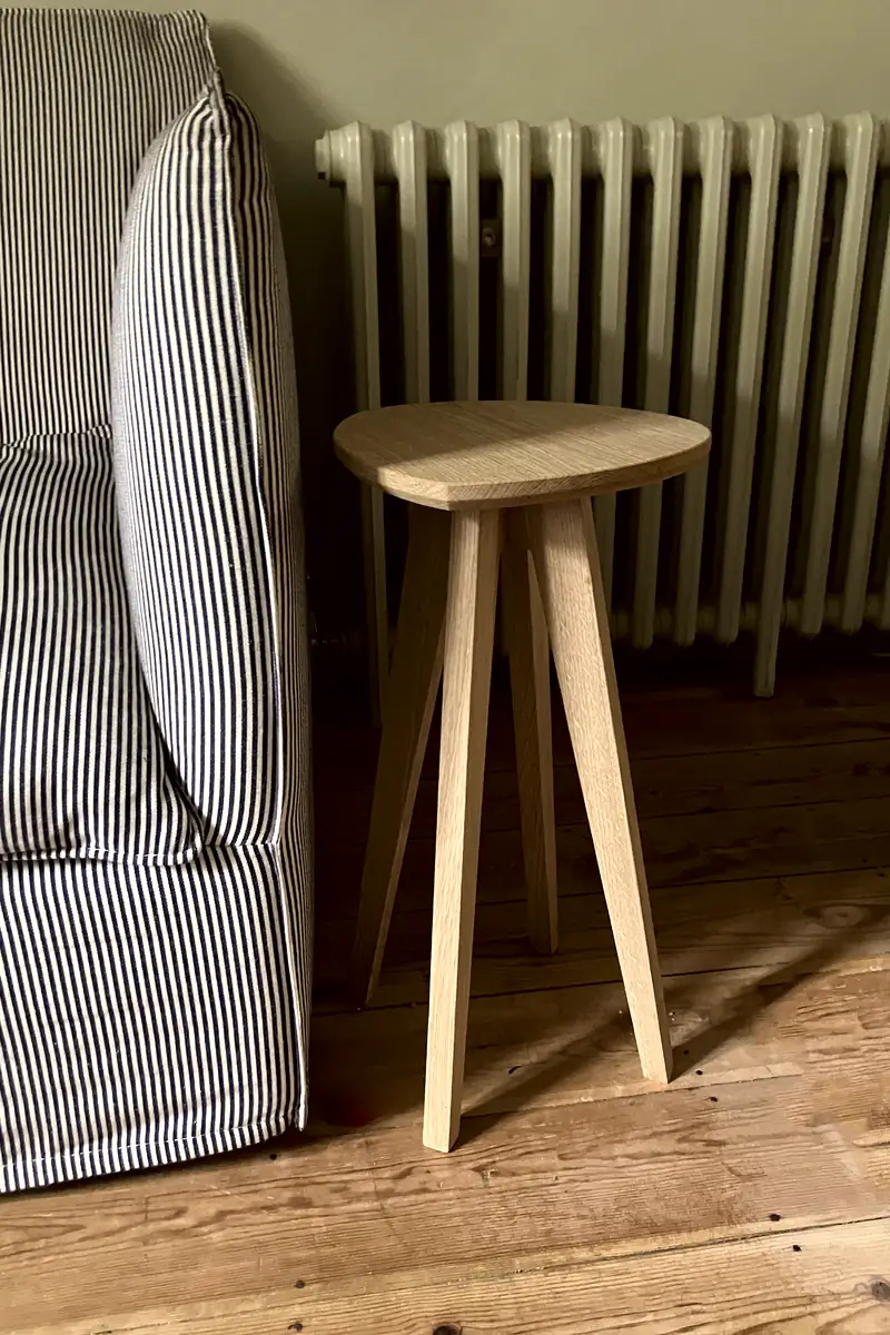 Solid oak side table with a uniquely shaped top