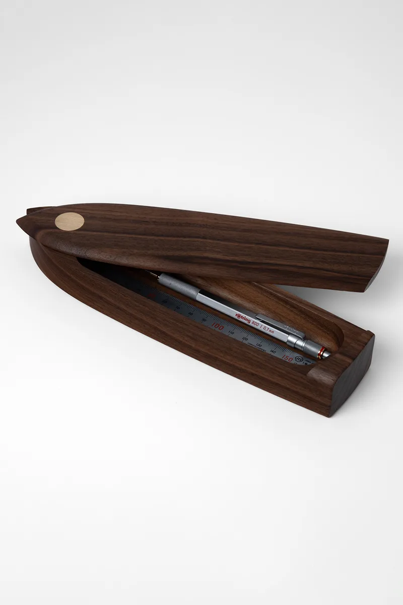 Walnut pen box open with pencil and ruler inside, showing the sailing boat hull form